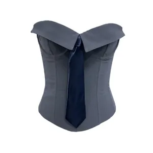 Close-up detail of grey fishbone corset vest featuring a navy blue tie and off-shoulder collar.
