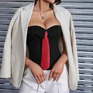 Detailed view of black strapless corset top with integrated red tie and boning structure