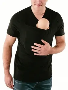 Detail view of black kangaroo pouch T-shirt for baby carrying and skin-to-skin contact.
