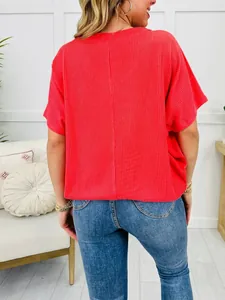 Detailed back view of a vibrant red ribbed short-sleeve top with a casual loose fit design