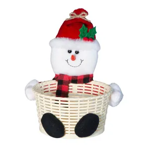 Detail view of a cute plush snowman Christmas candy basket for holiday table decor.