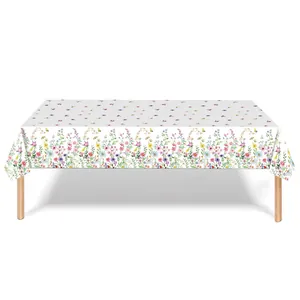 Detailed view of white waterproof PE tablecloth with vibrant wildflower print