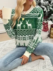 Detail view of cozy green Christmas sweater with reindeer and snowflake patterns