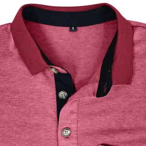 Macro shot of a red moisture-wicking polo shirt collar with a black trim and size S label