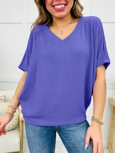 Close-up of purple V-neck ribbed T-shirt showing its soft texture and loose fit