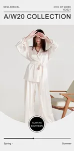 Full view of a woman wearing a luxurious cream faux silk robe and pants pajama set