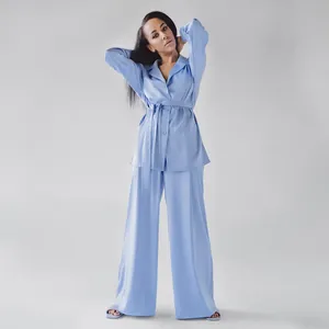 Elegant light blue faux silk two-piece pajama set with belted shirt and wide-leg pants