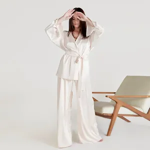 Elegant cream satin pajama set for women featuring a wrap top and wide-leg loungewear pants