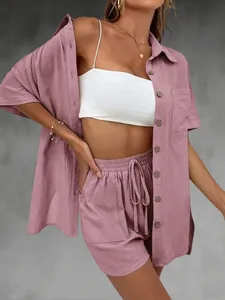 Mauve two-piece summer casual linen set with short-sleeve shirt and drawstring shorts.
