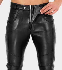Close-up detail of men's slim black faux leather punk pants with front zipper closure.