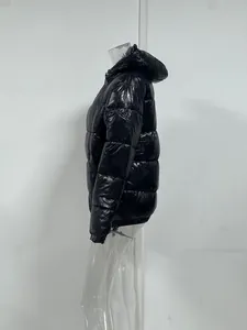 Detailed side view of a men's shiny black hooded puffer jacket with quilted design