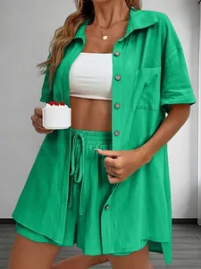Detailed view of a bright green short sleeve button-down shirt and matching shorts set