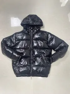 High-shine black men's hooded puffer jacket featuring heavy insulation for winter warmth