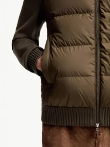 Men's olive green padded bomber jacket featuring knitted patchwork sleeves and zip closure