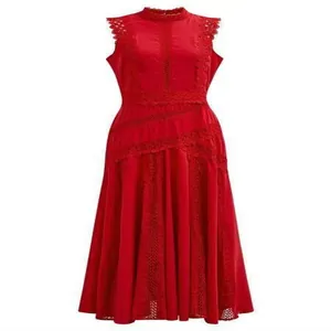 Close-up detail of sleeveless red midi dress with intricate lace hollow-out design.