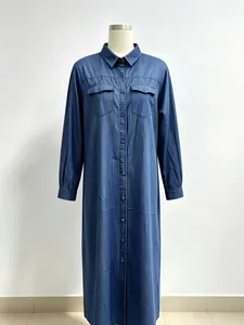 Front view of a long-sleeved navy blue denim maxi shirt dress displayed on a mannequin
