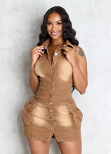 Close-up of sleeveless brown denim dress with functional 3D side pockets and slim fit.