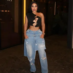Trendy street style set with distressed denim skirt-pants and safety pin crop top