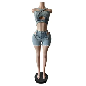 Front view of a blue denim two-piece set featuring a crisscross crop top and mini shorts.