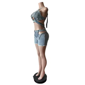 Side view of a blue denim two-piece set featuring a halter crop top and cutout shorts