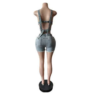 Back view detail of light blue denim vest and shorts set shown on mannequin stand