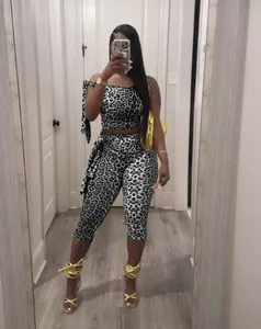 Stylish silver leopard print two-piece set featuring a crop top and lace-up cropped pants