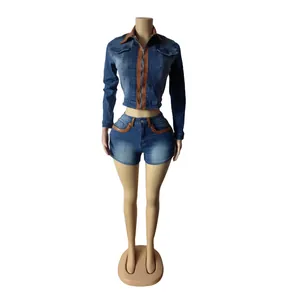 Slim fit denim two-piece set featuring long sleeve jacket and shorts with brown trim