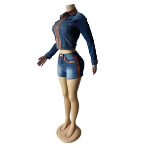 Detailed side view of vintage denim two-piece set with brown panels on mannequin