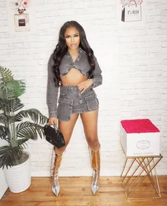 Lifestyle view of 2-piece denim set featuring a cropped top and cargo pocket mini skirt