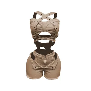 Detail view of a khaki denim two-piece set featuring a strappy crop top and matching shorts