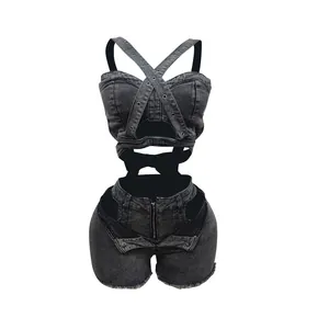 Detailed view of women's black denim set with cross-strap top and cut-out shorts