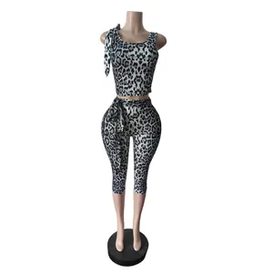 Detail view of women's leopard print set featuring tank top and cropped leggings