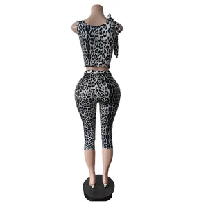 Rear view detail of leopard print two-piece set showing fit of crop top and leggings