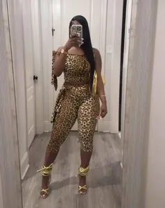 Close-up detail of a women's leopard print two-piece set with crop top and cropped pants.