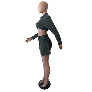 Side view of dark grey denim set featuring cropped jacket and 3D pocket mini skirt