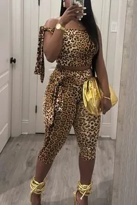 Fashionable leopard print two-piece set with tie-up crop top and cropped leggings.