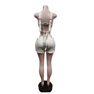 Back view of beige denim vest and shorts set showing tie-back detail and raw hem.