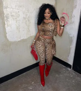 Detailed view of women's leopard print two-piece set with tie-up top and leggings.