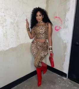 Trendy women's two-piece leopard print set featuring a sleeveless crop top and matching pants