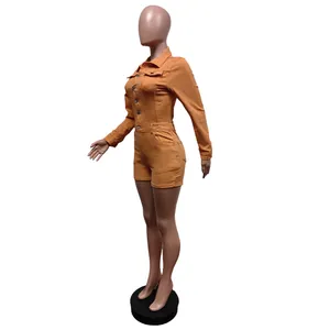 Side view of an orange long-sleeved stretch denim romper shown on a fashion mannequin