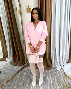 Stylish pink two-piece knit cardigan sweater and pleated mini skirt set for women fashion
