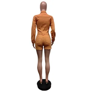 Detailed back view of a slim fit orange long-sleeve stretch denim romper for women