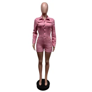 Professional front view of a pink long-sleeve stretch denim romper on a mannequin.