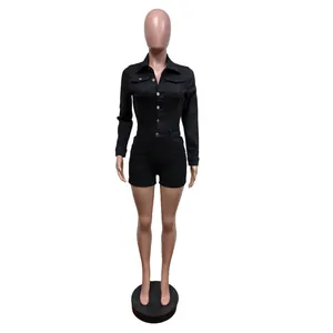 Full front view of a long-sleeved black denim stretch romper with button closure