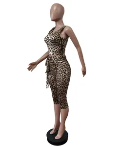 Detailed side view of leopard print two-piece set with crop top and cropped pants on mannequin.