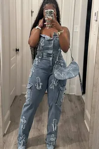 Denim strapless jumpsuit featuring cross embroidery and cargo pockets for women.
