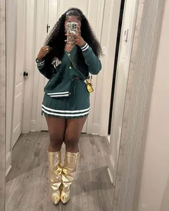 Lifestyle fit photo of green knit cardigan and pleated mini skirt set with white stripes