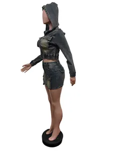 Detail of the hooded denim jacket and mini skirt set on a mannequin
