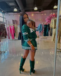 Fashionable women's green knitted cardigan and pleated mini skirt two-piece set outfit