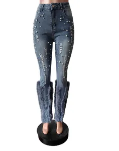 Distressed blue jeans with pearl embellishments and blue fur cuffs
